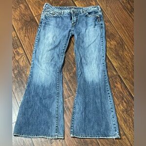 Silver Jeans Cinder flared denim in a medium blue wash